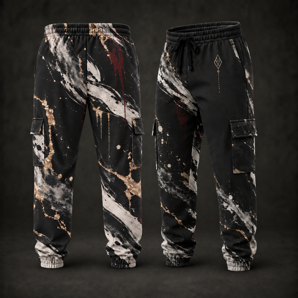 A pair of black cargo jogger pants with a distressed, splattered print in white, gray, and gold, shown from both the front and back angles against a dark studio background.