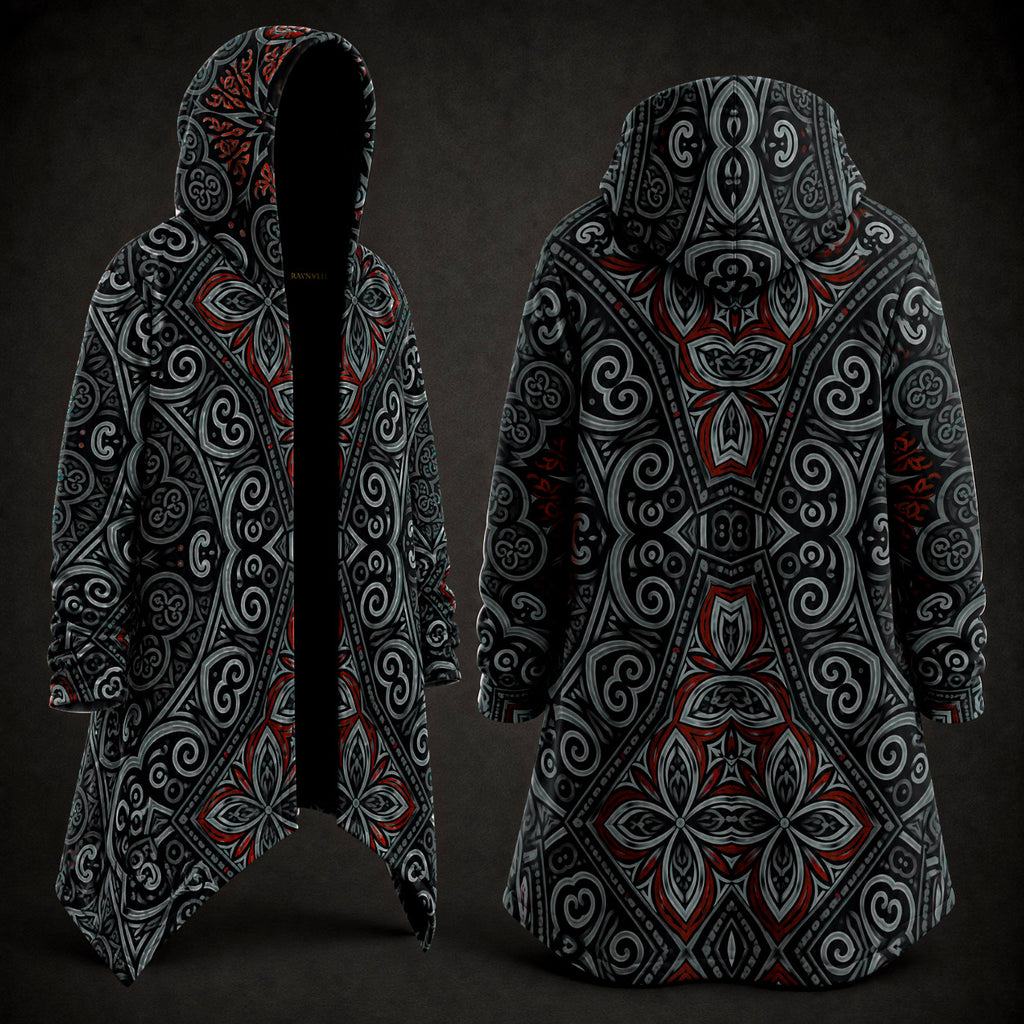 A hooded longline coat shown from the front and back on a dark studio background. The garment has an all-over ornate symmetrical pattern in black, gray, white, and red, with a black hood and black open front on the front view.